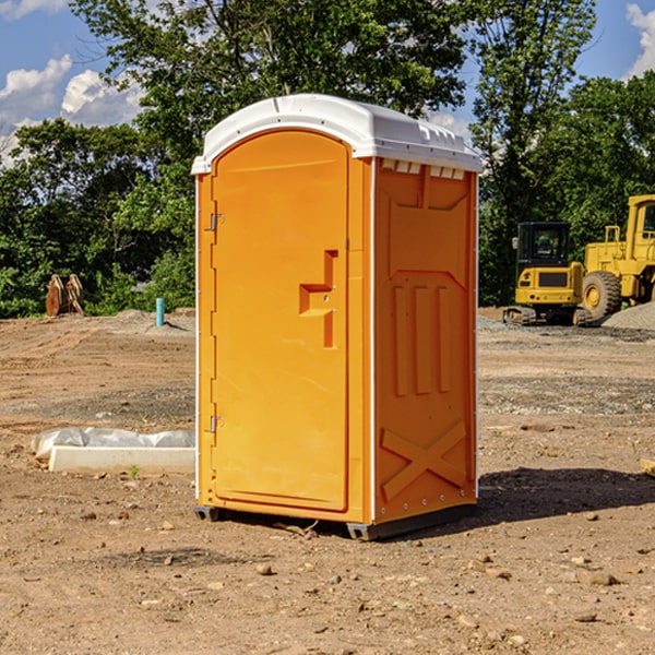 what is the cost difference between standard and deluxe portable restroom rentals in Gurley